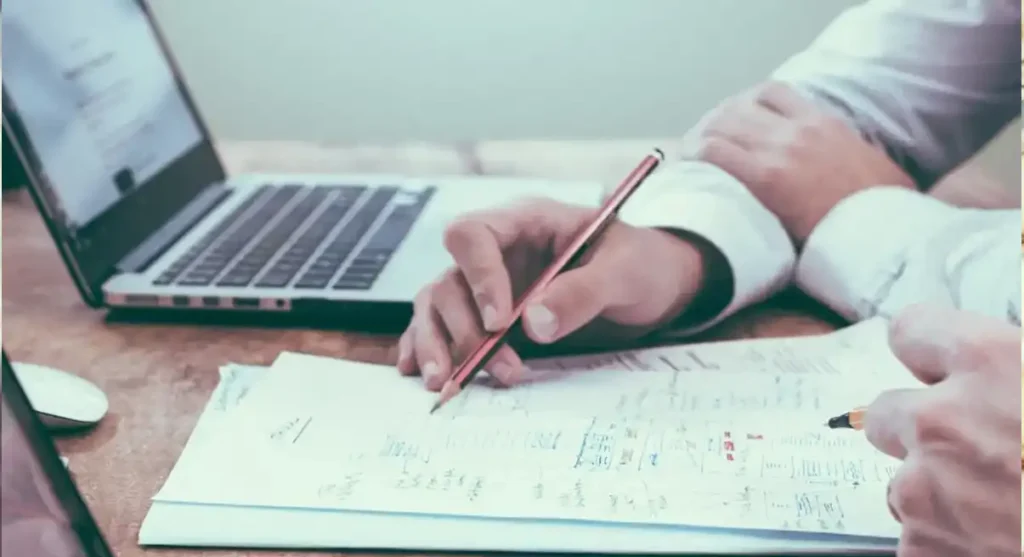 paper desk and computer