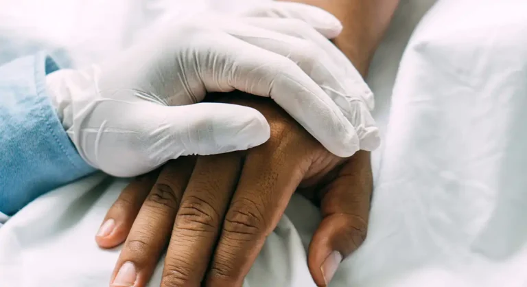 holding hands of the sick