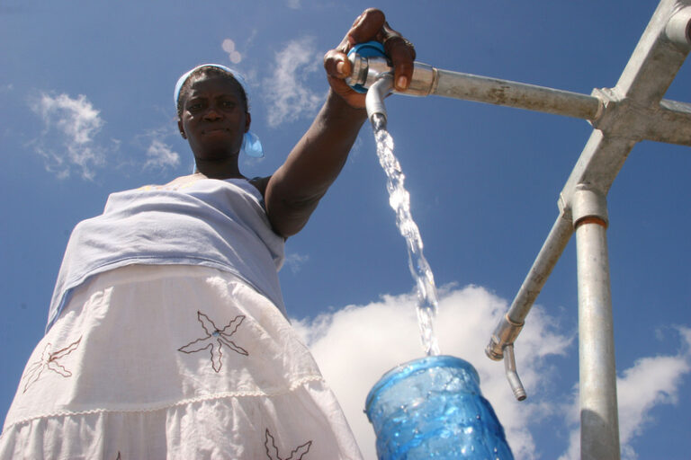 women retrieving water