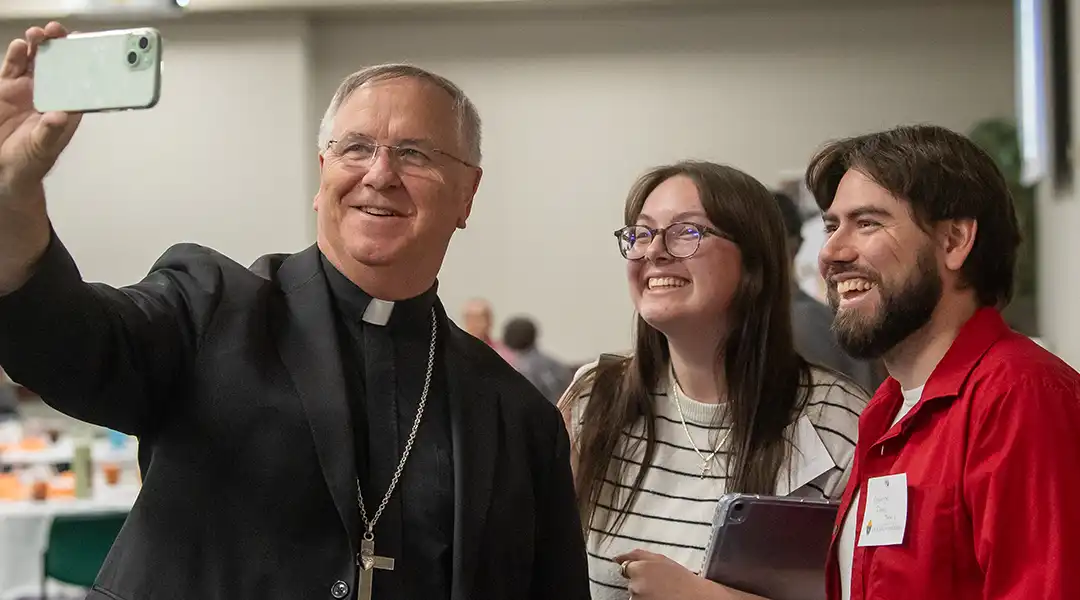 Bishop taking a Selfie with Young Adults