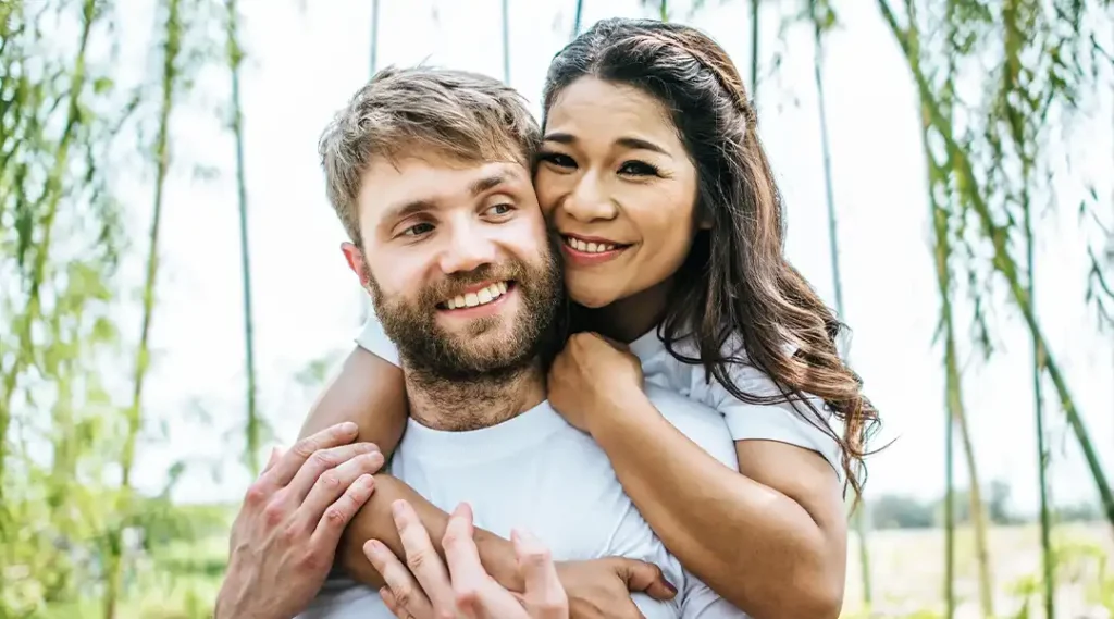 couple embracing smiling