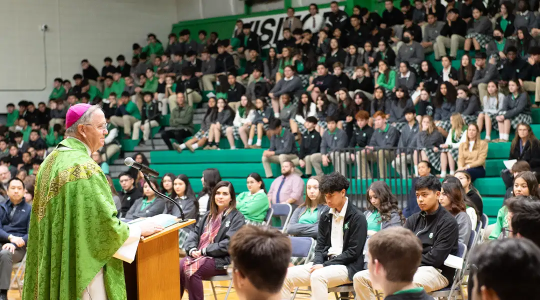 Bishop addressing the youth at school mass
